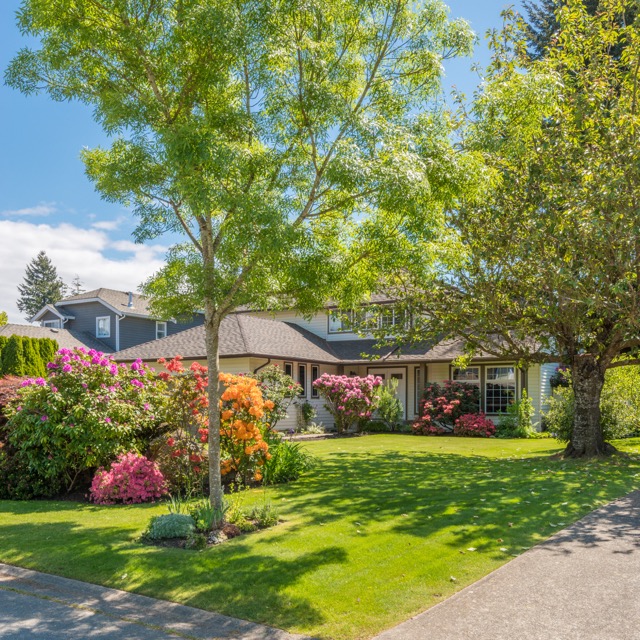 A perfect neighborhood. Houses in suburb at Spring in the north America. Great outdoor landscape.